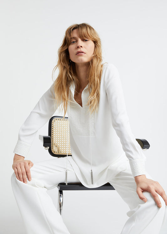 Tunic with embroidered bib