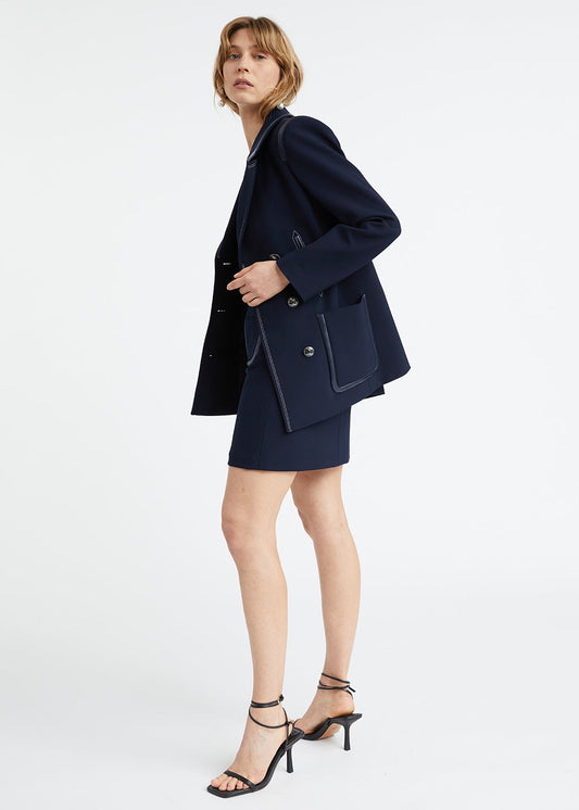 Navy double-breasted pea coat with eco-leather details